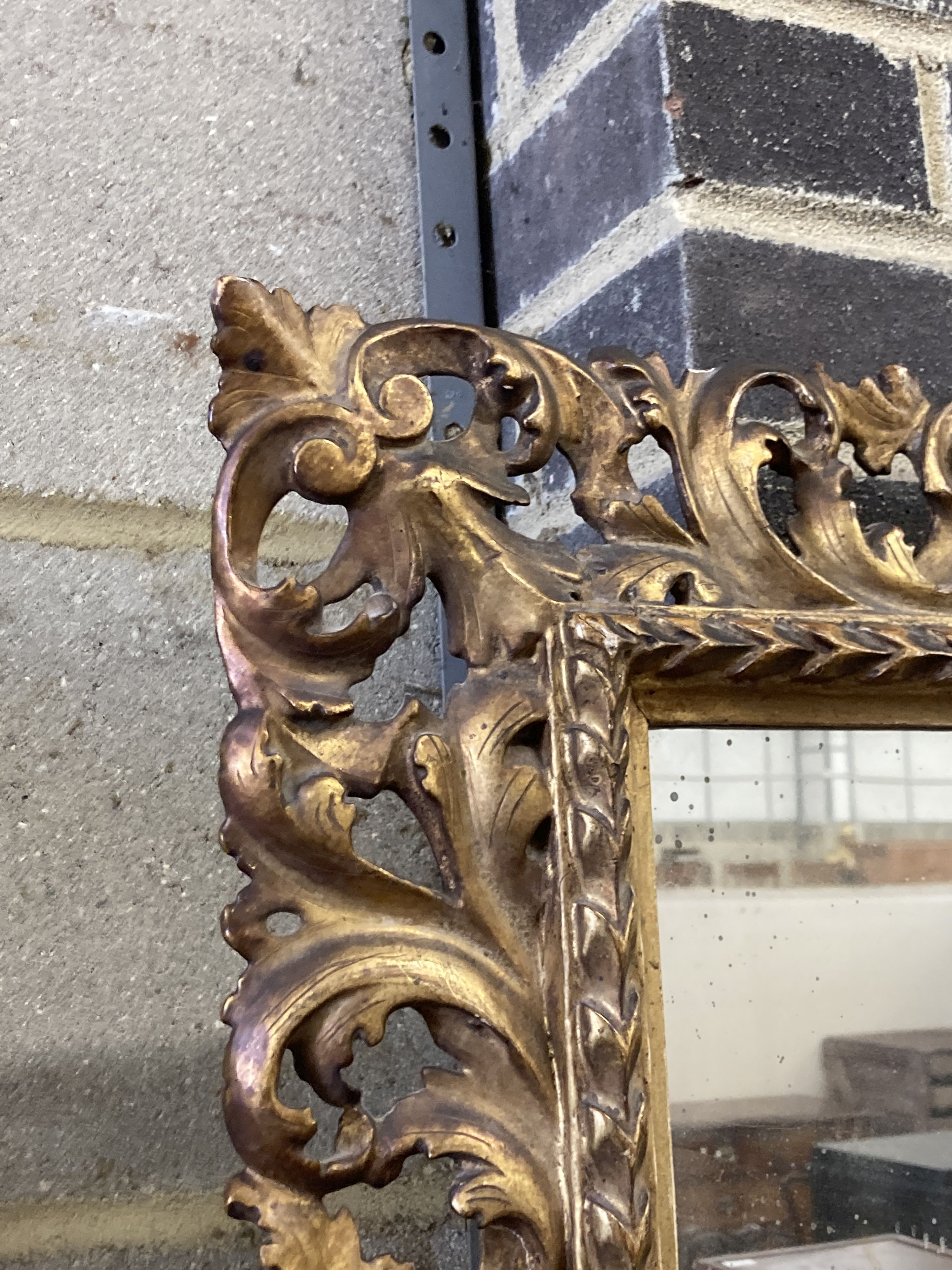 A 19th century Florentine style carved giltwood wall mirror, width 60cm, height 70cm